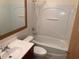 Well-lit bathroom features a tub, toilet and vanity with sink at 4941 25Th W St # 101, Bradenton, FL 34207