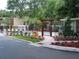 View of community pool from landscaped entrance at 4941 25Th W St # 101, Bradenton, FL 34207