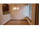 Cozy dining room filled with natural light from the window and a modern light fixture at 4941 25Th W St # 101, Bradenton, FL 34207