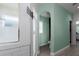 Well-lit bathroom with a glass door shower, toilet and window at 5209 Lansdowne Way, Palmetto, FL 34221