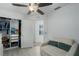 Bedroom with a ceiling fan, closet, an egress window and a sofa at 5209 Lansdowne Way, Palmetto, FL 34221