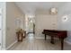 Elegant entryway with tiled floors, a chandelier, and a view of the front door and landscape at 5209 Lansdowne Way, Palmetto, FL 34221