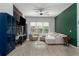 Comfortable living room featuring tile floors, ample seating, and a large window with natural light at 5209 Lansdowne Way, Palmetto, FL 34221