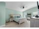 Serene main bedroom with vaulted ceilings, a comfortable bed, and a cozy workspace at 5209 Lansdowne Way, Palmetto, FL 34221