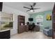 Home office featuring built-in shelves, a desk and chair, and a bright window at 5209 Lansdowne Way, Palmetto, FL 34221