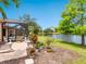 Beautiful backyard with patio and a view of the lake at 521 Habitat Blvd, Osprey, FL 34229