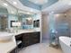 Bathroom with double sinks, a walk in shower and bathtub at 521 Habitat Blvd, Osprey, FL 34229