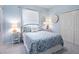 Bright bedroom in calming blue hues, featuring a window and 'Relax' pillow on the bed at 521 Habitat Blvd, Osprey, FL 34229