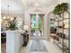 Elegant foyer featuring double doors, tile flooring, and decorative accents that enhance the home's appeal at 521 Habitat Blvd, Osprey, FL 34229