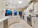 Bright, spacious kitchen with white cabinetry, stainless steel appliances, and center island at 521 Habitat Blvd, Osprey, FL 34229