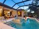 Inviting outdoor screened lanai featuring a pool, spa, and comfortable seating, perfect for relaxation at 521 Habitat Blvd, Osprey, FL 34229