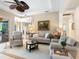 Cozy living room with comfortable seating, elegant decor, and a view into the dining area at 521 Habitat Blvd, Osprey, FL 34229