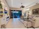 Inviting living room featuring a fireplace, built-ins, and sliding glass doors leading to the lanai at 521 Habitat Blvd, Osprey, FL 34229