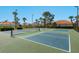 Well-maintained community pickleball courts with lush landscaping; ideal for active residents and recreational activities at 521 Habitat Blvd, Osprey, FL 34229