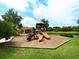 Community playground for children with slides and a gazebo, set in a park-like setting with serene lake views at 521 Habitat Blvd, Osprey, FL 34229