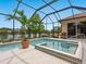 Beautiful screened in pool overlooking a peaceful lake at 521 Habitat Blvd, Osprey, FL 34229