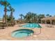 Inviting community pool and hot tub area surrounded by lush landscaping, offering a relaxing and resort-style experience at 521 Habitat Blvd, Osprey, FL 34229