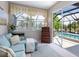 Sitting room with view of the pool at 521 Habitat Blvd, Osprey, FL 34229