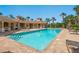 Sparkling community pool with lounge chairs, tables and a covered eating area; perfect for relaxing and entertaining at 521 Habitat Blvd, Osprey, FL 34229