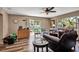 A bright living room with a sliding door to the backyard and comfortable seating at 5705 9Th Ave Dr W, Bradenton, FL 34209