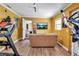 Home gym with modern equipment and a wall-mounted TV with views of a lake, a cozy seating area at 5705 9Th Ave Dr W, Bradenton, FL 34209