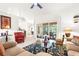 Bright and airy living room with neutral tones, tile floors, and access to the lanai at 5945 Nyberg Rd, North Port, FL 34286