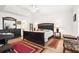 Comfortable main bedroom with a ceiling fan, ensuite bathroom and walk-in closet at 5945 Nyberg Rd, North Port, FL 34286
