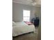 Cozy bedroom with natural light, ceiling fan, and dresser at 6357 Partridge Ave, Englewood, FL 34224