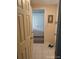Bright hallway leading to closet with folding doors and featuring tile flooring at 6357 Partridge Ave, Englewood, FL 34224