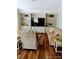 Bright living room with built-in shelving, recessed lighting, and comfortable seating area and wood laminate flooring at 6357 Partridge Ave, Englewood, FL 34224
