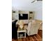 Comfortable living room with built-in shelving, recessed lighting, and comfortable seating area and wood laminate flooring at 6357 Partridge Ave, Englewood, FL 34224