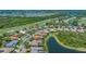 Scenic aerial view of homes in a golf course community, featuring waterfront properties and lush landscaping at 6633 The Masters Ave, Lakewood Ranch, FL 34202