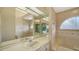 This bathroom has decorative tile, window, and a double vanity at 6633 The Masters Ave, Lakewood Ranch, FL 34202