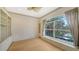 This bedroom features built-in cabinets and a large window with views at 6633 The Masters Ave, Lakewood Ranch, FL 34202