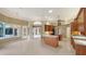 Open kitchen with center island, modern appliances, stylish lighting, and access to multiple rooms at 6633 The Masters Ave, Lakewood Ranch, FL 34202