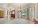 Formal room featuring elegant architectural columns, chandelier, and large windows at 6633 The Masters Ave, Lakewood Ranch, FL 34202