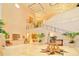 Grand lobby features high ceilings, elegant staircase, beautiful plants and travertine floors at 6633 The Masters Ave, Lakewood Ranch, FL 34202