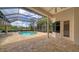 Screened-in pool and spa area with an extended patio and lush, private landscaping at 6633 The Masters Ave, Lakewood Ranch, FL 34202