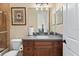 Bathroom featuring a glass shower door, wood cabinet, and granite countertop at 6951 Scrub Jay Dr, Sarasota, FL 34241