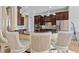 Kitchen featuring stainless steel appliances, granite countertops, barstool seating, and modern pendant lighting at 6951 Scrub Jay Dr, Sarasota, FL 34241