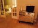 Bedroom view featuring a mirrored dresser and bed at 7050 Fairway Bend Ln # 167, Sarasota, FL 34243