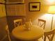 Dining area with a round table and chairs at 7050 Fairway Bend Ln # 167, Sarasota, FL 34243