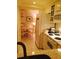 Cozy kitchen with white appliances, a dining area, and tiled floors at 7050 Fairway Bend Ln # 167, Sarasota, FL 34243