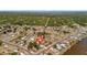 Stunning aerial view of homes and a quiet neighborhood surrounded by beautiful landscaping at 7055 Kenwood Dr, North Port, FL 34287