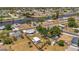 Aerial view of a blue single-story home with canal views and a detached building in the backyard at 7055 Kenwood Dr, North Port, FL 34287