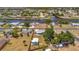 Aerial view of a blue single-story home with canal views and a detached building in the backyard at 7055 Kenwood Dr, North Port, FL 34287