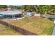 Large fenced backyard with screened in porch and detached shed, perfect for entertaining and storage at 7055 Kenwood Dr, North Port, FL 34287