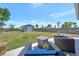 Expansive backyard featuring a new custom shed and patio with outdoor seating at 7055 Kenwood Dr, North Port, FL 34287