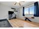 Bright bedroom with a ceiling fan, modern desk, and a large window offering lots of natural light at 7055 Kenwood Dr, North Port, FL 34287