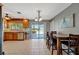 Bright dining area with sliding glass doors to the patio and convenient access to the kitchen at 7055 Kenwood Dr, North Port, FL 34287